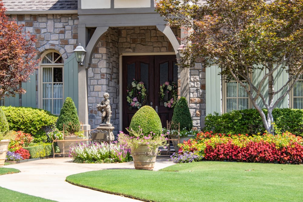 High-end residential front yard landscaping and garden bed installation for a home in Hamilton, Ontario.
